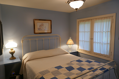 Antique bedroom with quilt