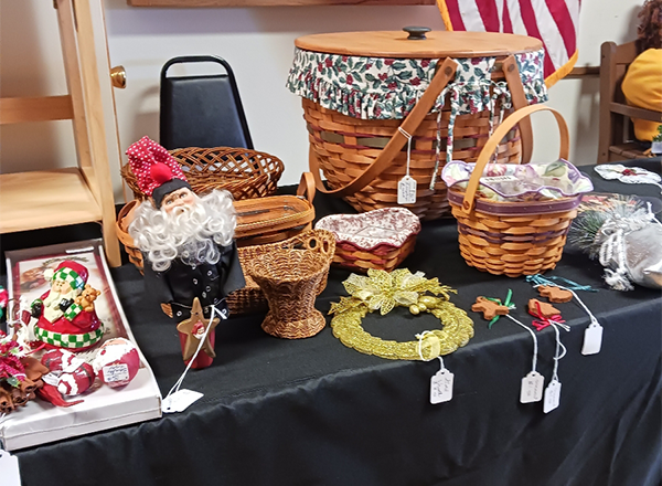 dahlia house table with baskets and other antique items